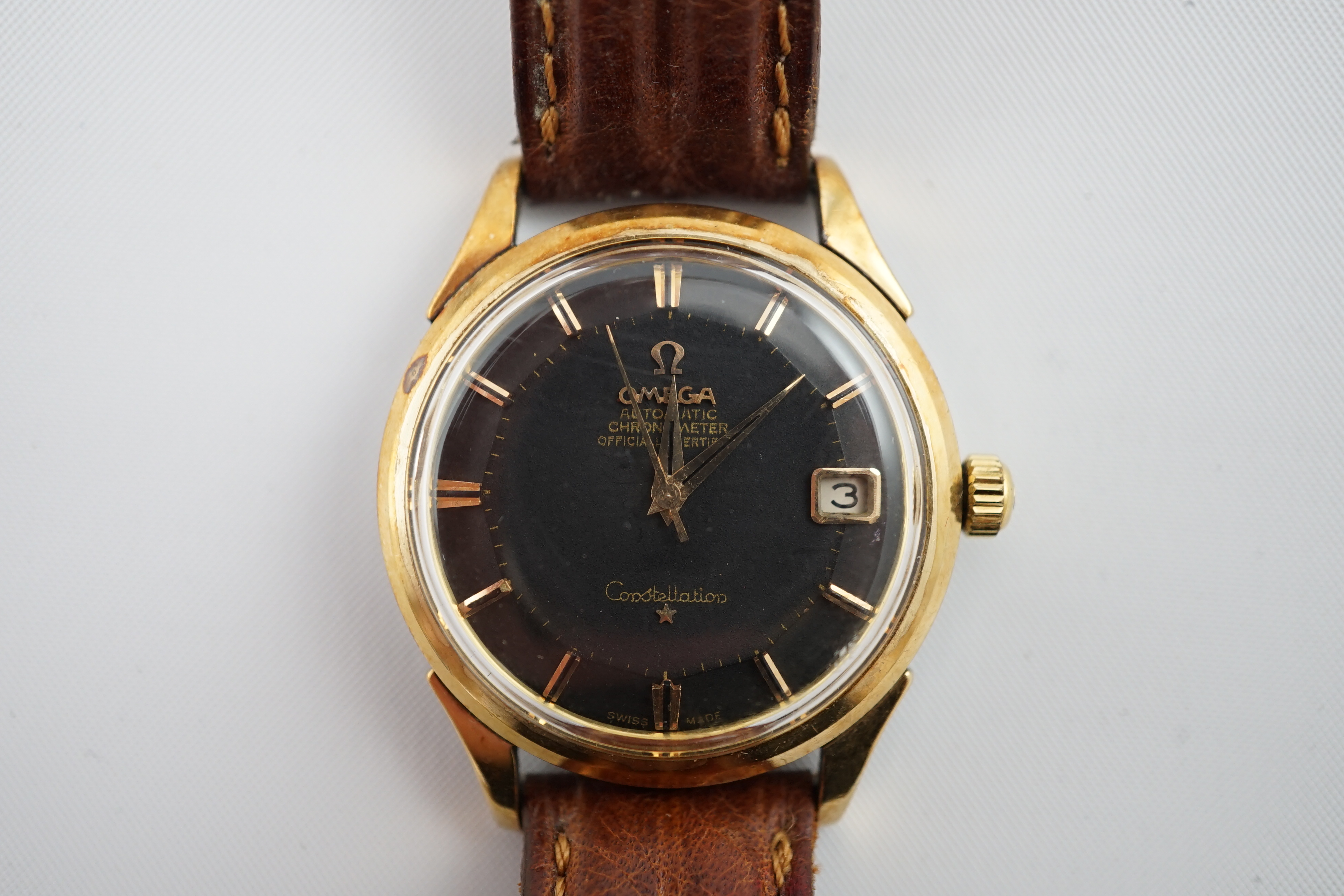 A gentleman's 1960's stainless steel and gold plated Omega Automatic Chronometer Constellation 'pie pan' black dial wrist watch